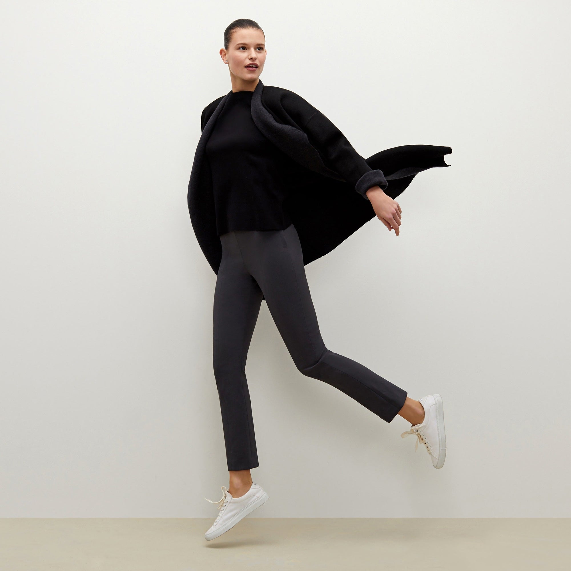 Front image of a woman standing wearing the foster pant in monsoon