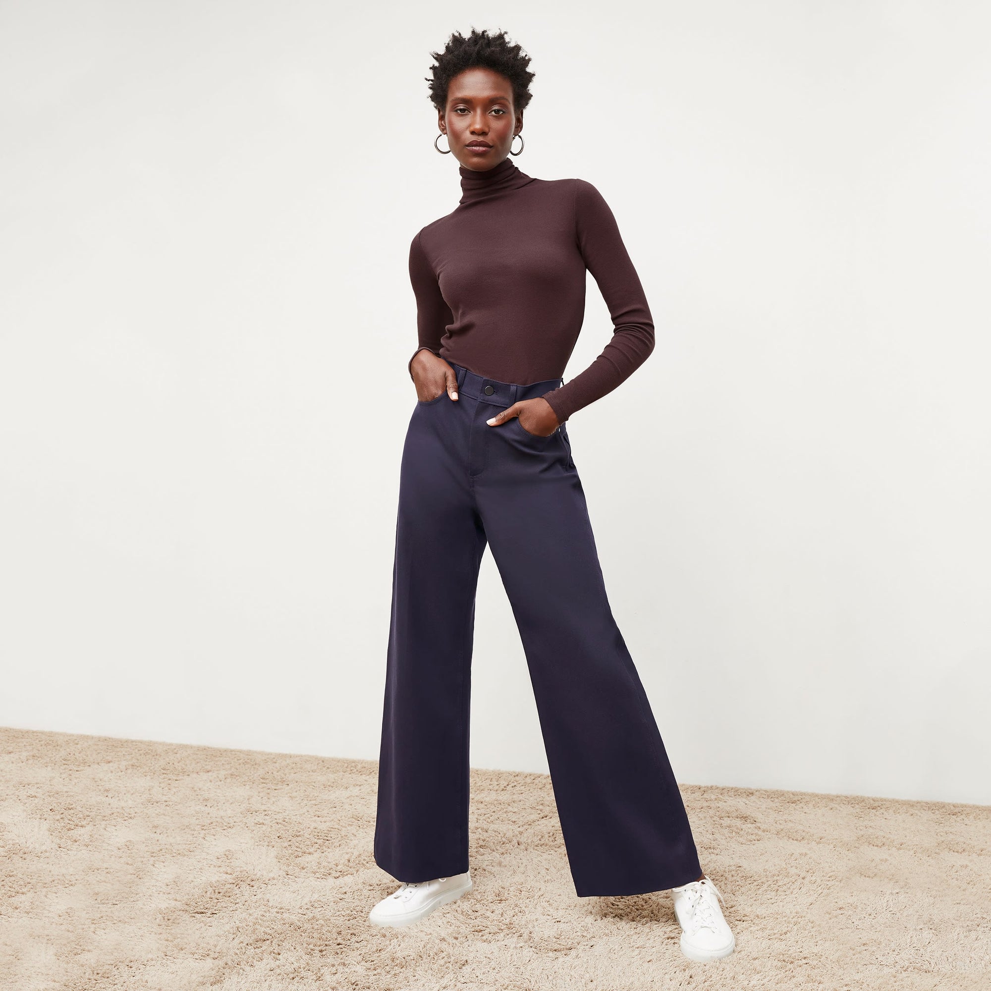 Front image of a woman standing wearing the Milo Jean in ink | Exclude