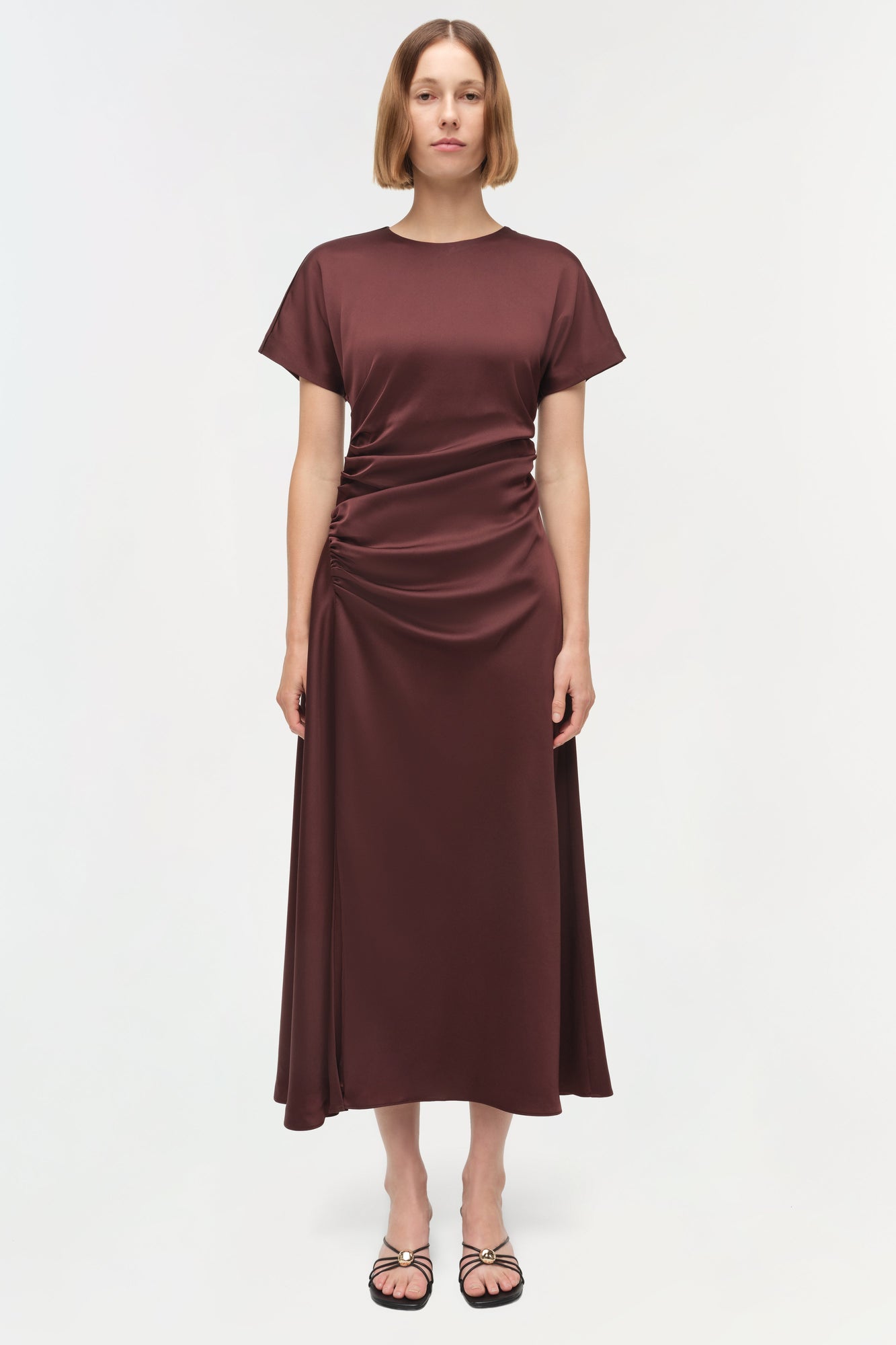 Burgundy satin midi dress with short sleeves, crew neckline, and ruched side detailing on the bodice.