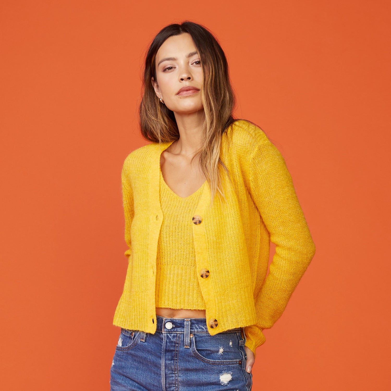 Front view of model wearing the mohair cardigan in sunshine.