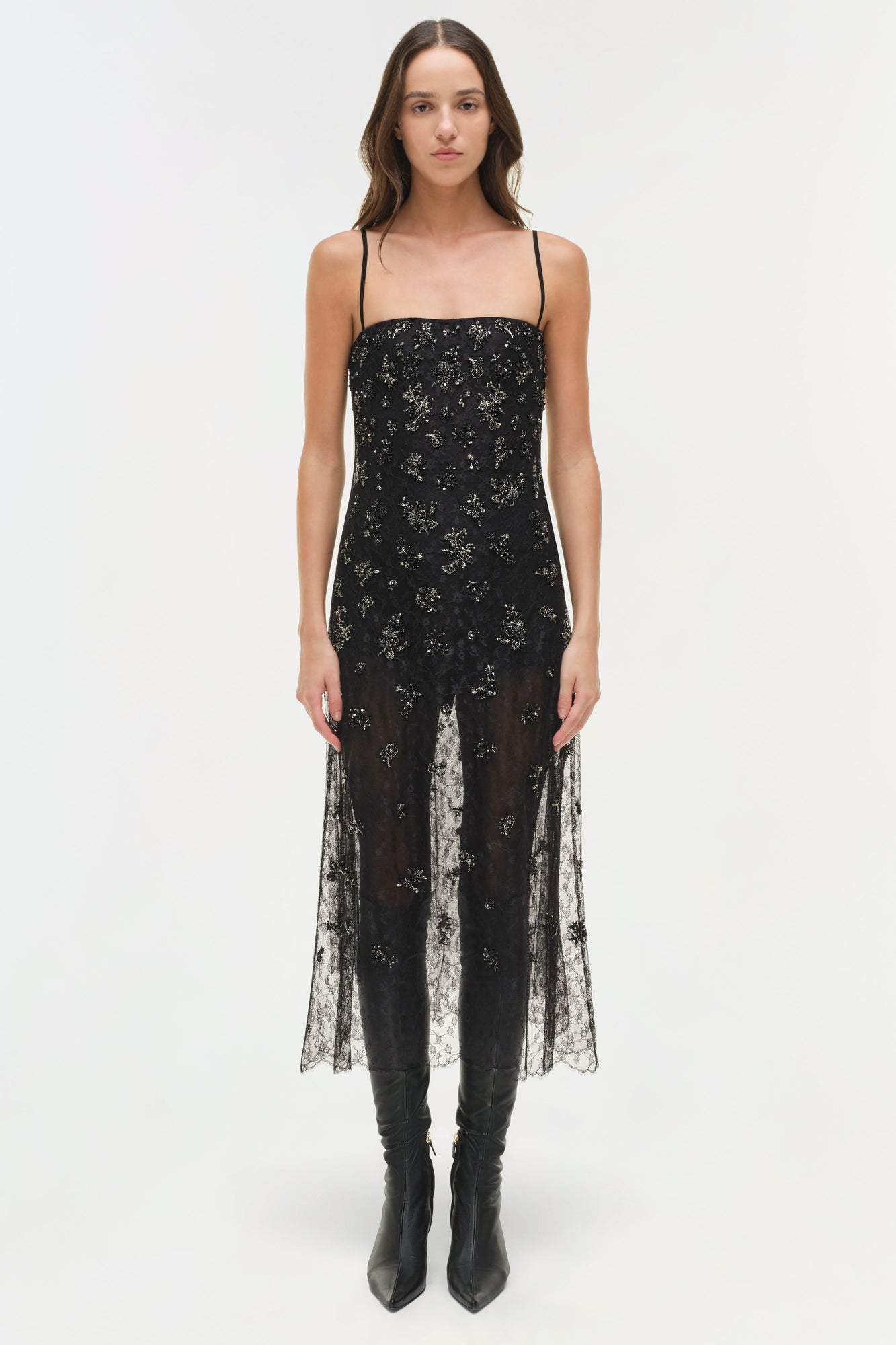 Black lace midi dress with delicate embellishments, thin straps, and sheer lace panels at the hem.
