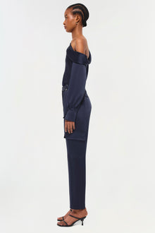 Navy off-shoulder jumpsuit with cargo pockets and long sleeves, shown on model in profile view.