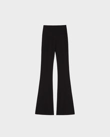 The ADRIANA - 8524009 Black high-waisted, flared-leg leggings by Rudsak are laid flat on a plain white background.