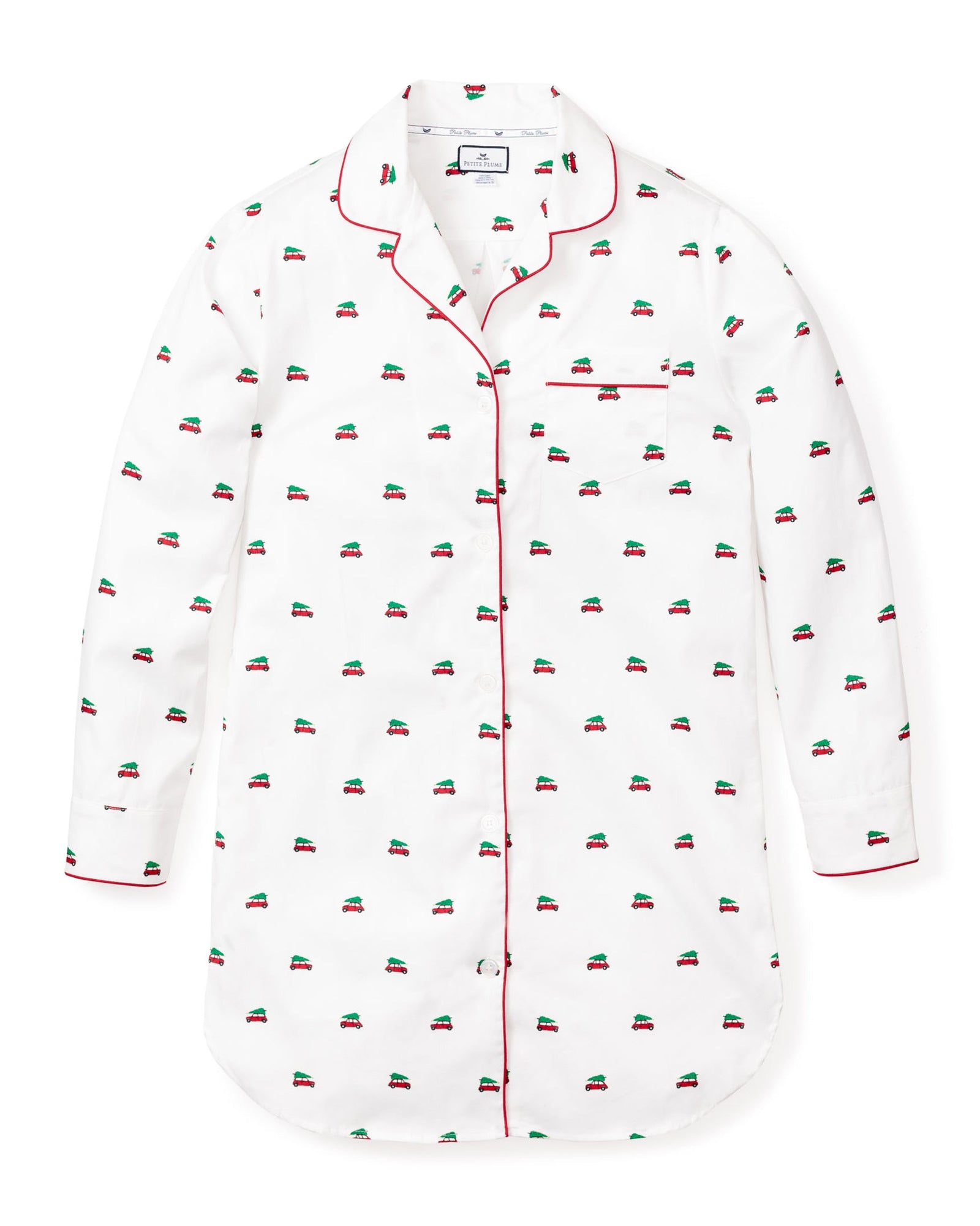 The Womens Twill Nightshirt in Holiday Journey by Petite Plume is a white nightshirt made from 100% cotton twill, with red piping and embroidered small car patterns. It features a button-down front, a single chest pocket, and a curved hem for added charm.