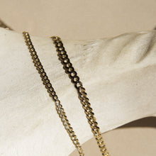Flatlay Model. Two gold chain necklaces on neutral background