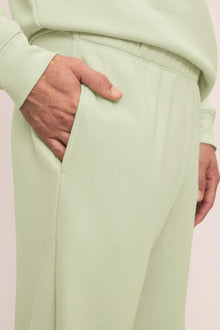 Model is wearing Mens French Terry Jogger in Matcha