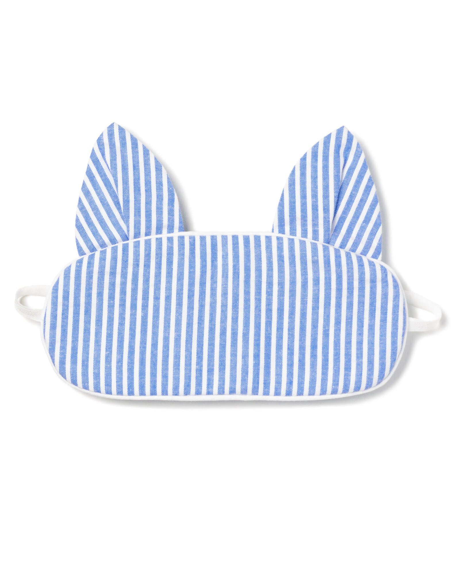 The Kids Kitty Sleep Mask in French Blue Seersucker by Petite Plume features cat-like ears and elastic straps for a snug fit. This playful mask can be monogrammed, making it an ideal gift. Consider matching masks for friends to share the cozy charm.