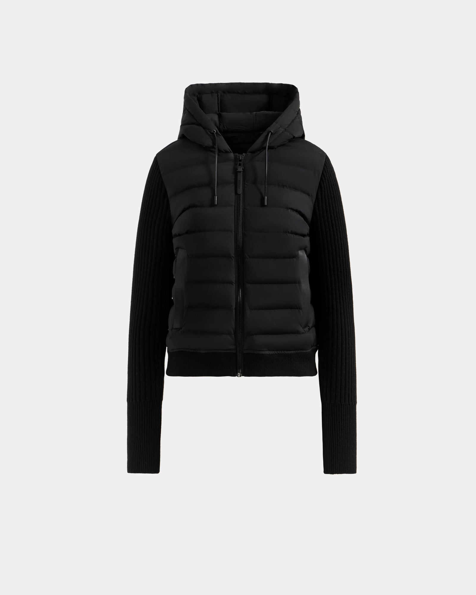 The Rudsak EMILY - L125515 Black is a women’s hooded down bomber with a front zipper, quilted RDS-certified down body, ribbed knit sleeves, fitted silhouette, and adjustable hood drawstrings, shown on a light gray background.