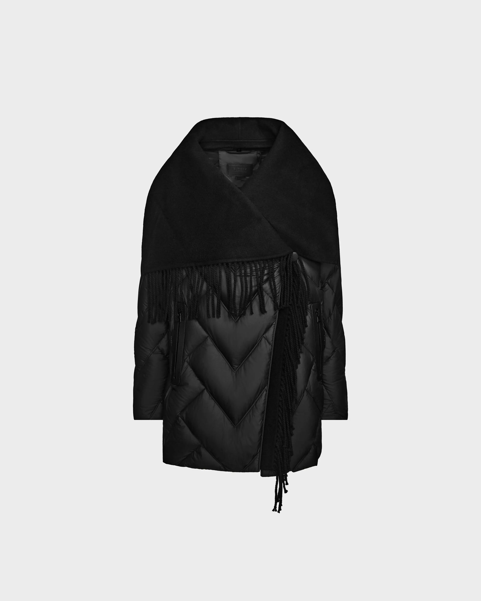 The Rudsak ANNE MARIE - 8124713 Black is a chic womens mid-length quilted down wool jacket featuring a wide shawl collar and long fringed scarf, shown draped asymmetrically on a plain light grey background.