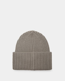 The COLIN - 9424518 Cement by Rudsak is a grey unisex ribbed knit beanie crafted from soft material, displayed elegantly on a white background.