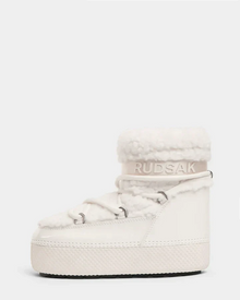 The KATHY - 8223513 Iceland by Rudsak is a white women's high-top winter boot with a thick sole, faux shearling collar, lace-up front, Rudsak branding at the ankle, a textured water-repellent base, and cozy modern moon boot style.