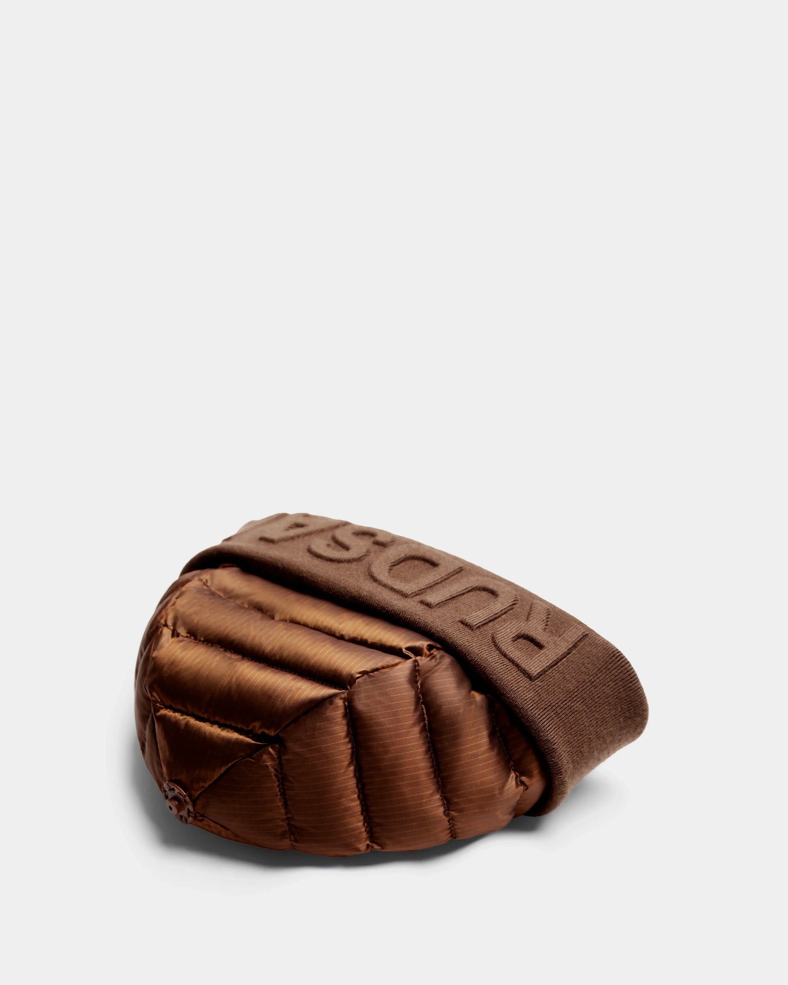 The Rudsak OLYA - 8422504 Antique Bronze is a women’s brown winter beanie with a matching band, topped with a chic fur pompom for extra warmth and charm.