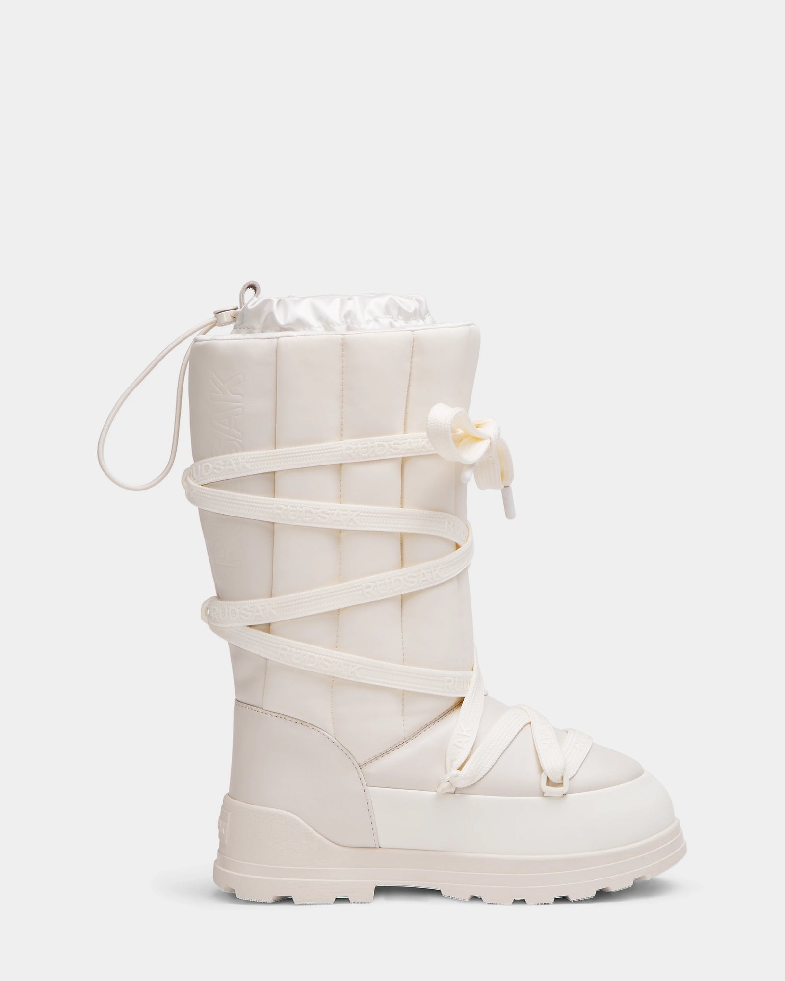 The Rudsak RODIN - 8224502 Iceland is a single off-white womens winter boot with quilted design, polar fleece lining, thick anti-slip sole, wraparound laces, and top drawstring closure displayed on a plain light background.