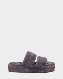 The ZETA - 8224508 Grey by Rudsak is a womens faux fur slipper featuring two thick, fuzzy straps and a plush sole, displayed in side profile on a plain white background.