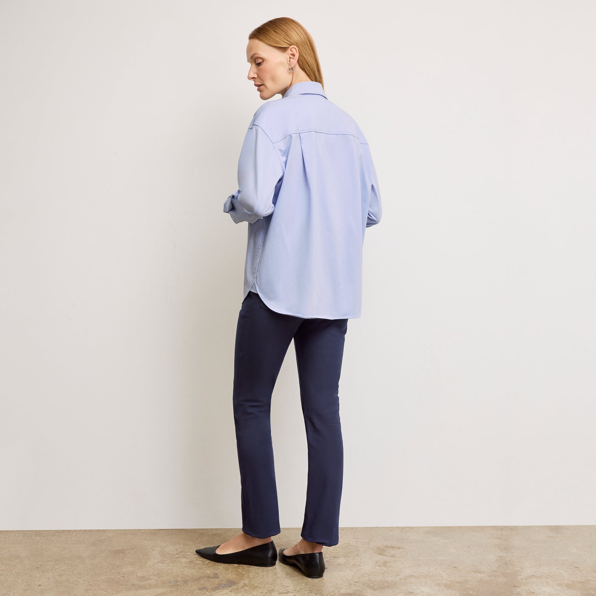 back image of a woman wearing the roma pants in dark navy | Exclude