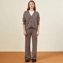 Front view of model in the marled oversized cardigan in black sesame.