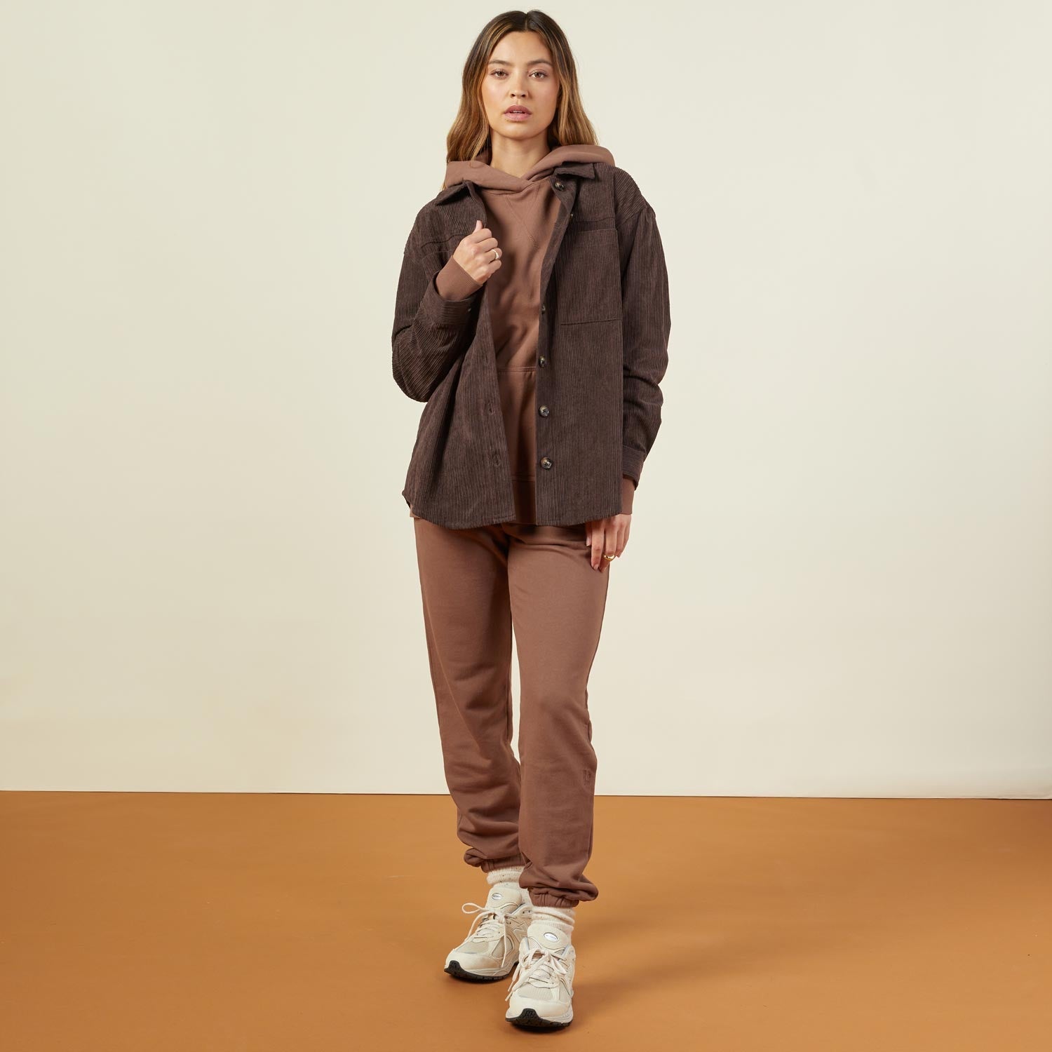 Front view of model wearing the corduroy shacket in dark oak.