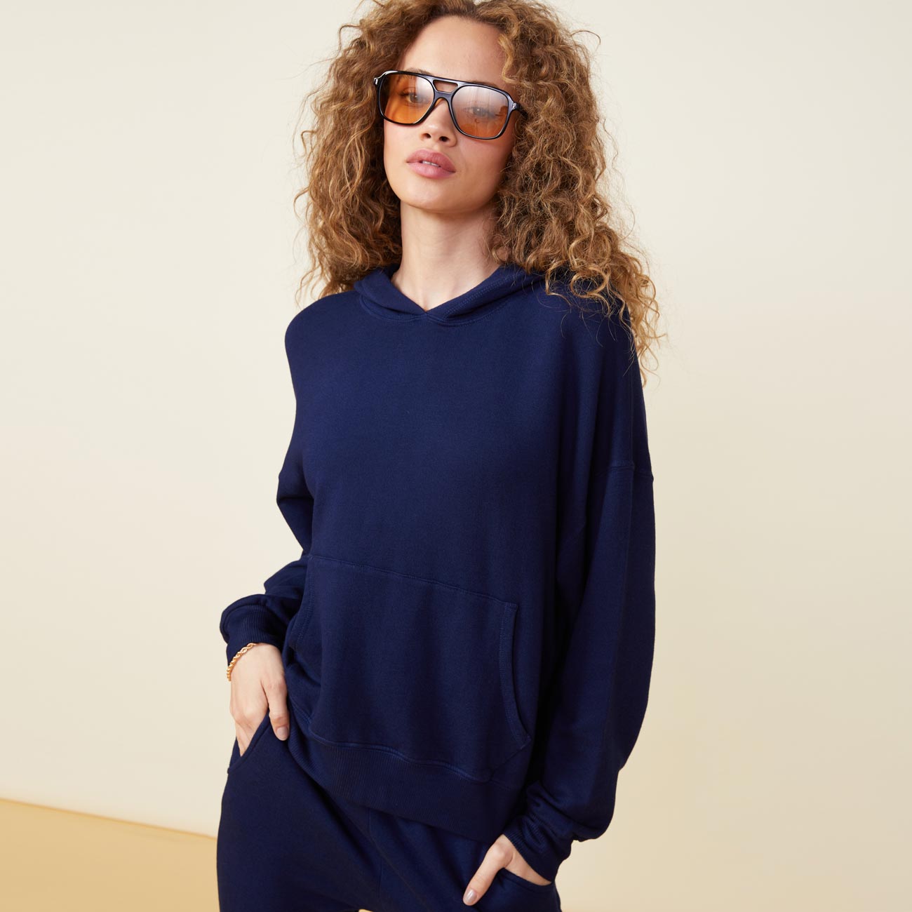 Front view of model wearing the supersoft fleece slouchy pullover in navy.