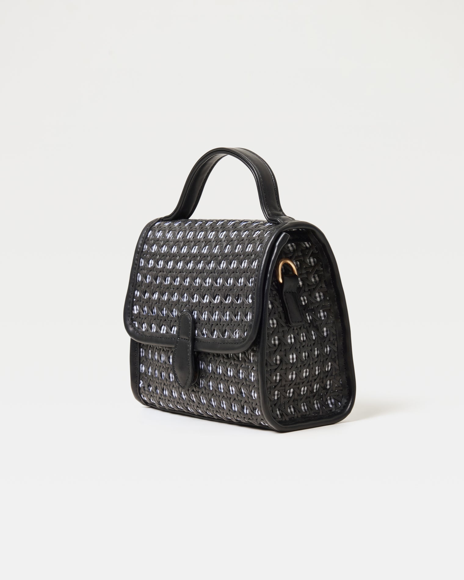 Angled view of the Amelia Bag in black showing the structured silhouette and woven detail.