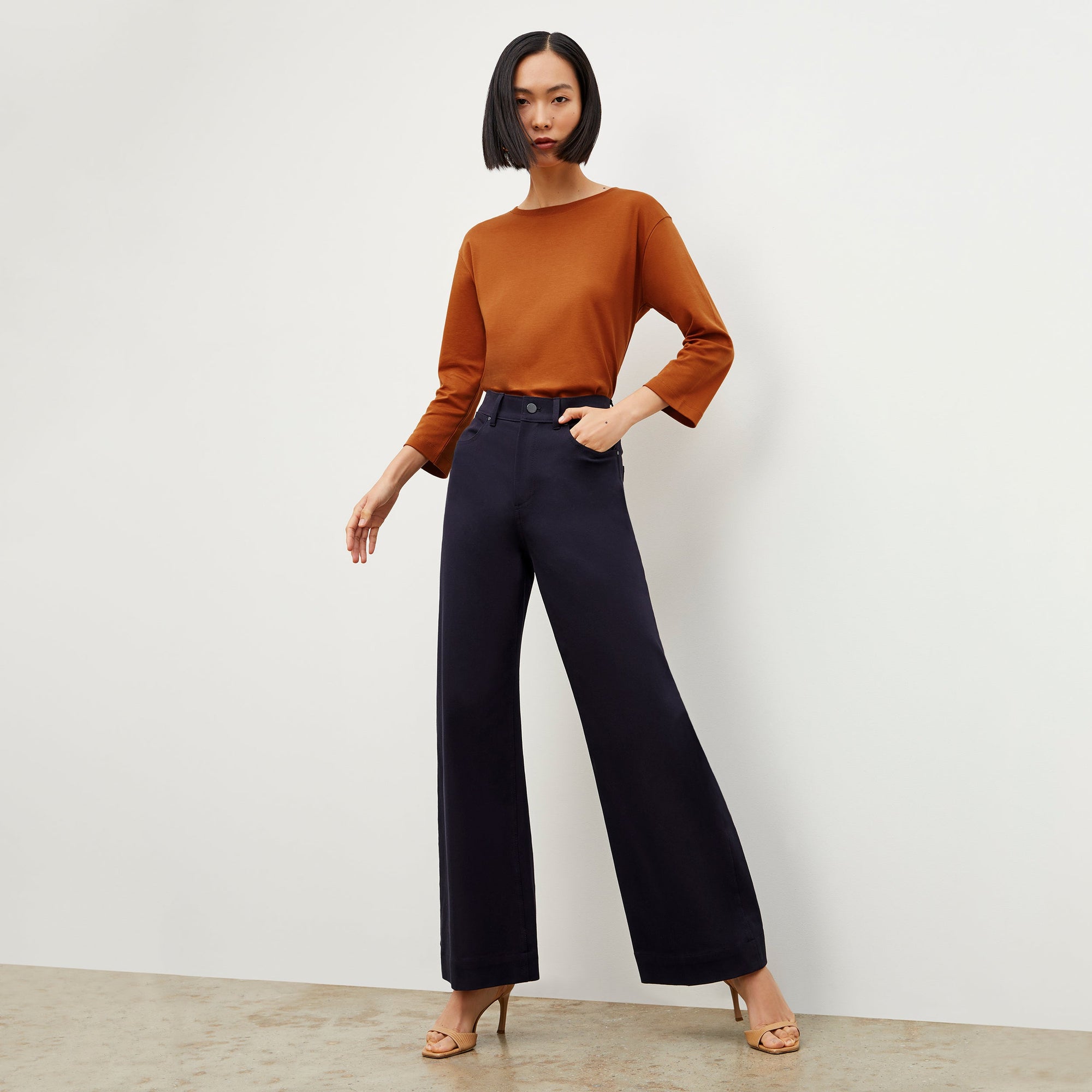 Front image of a woman standing wearing the Milo Jean in ink | Exclude