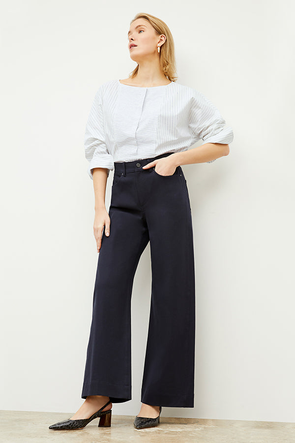Front image of a woman standing wearing the Milo Jean in ink | Exclude