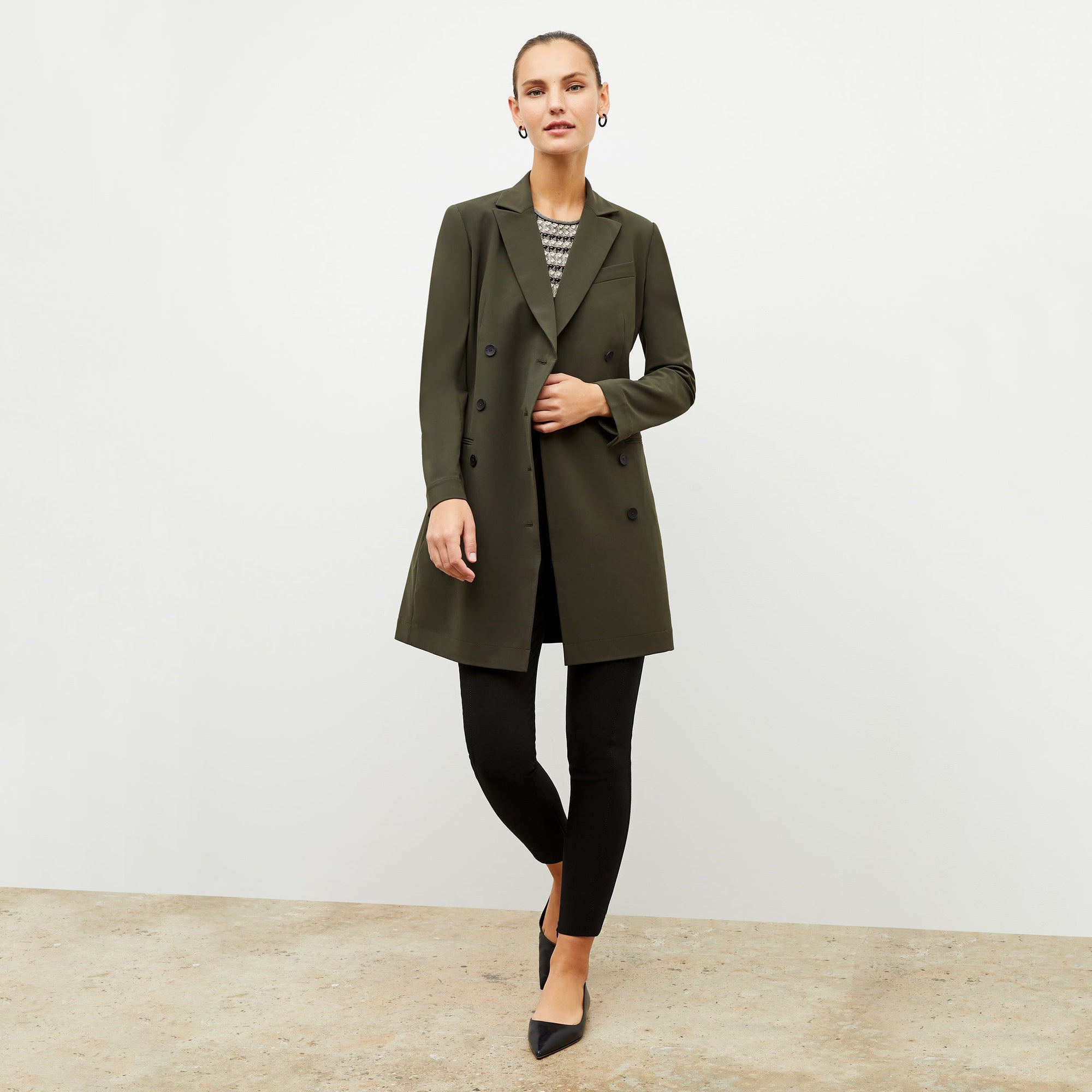 Front image of a woman wearing the gwynne dress in olive