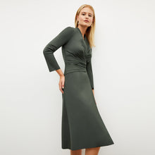 Image of a woman wearing the Carly Dress in Dark Aloe