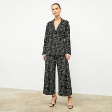 front image of a woman wearing the alyssa jacket in symphony print