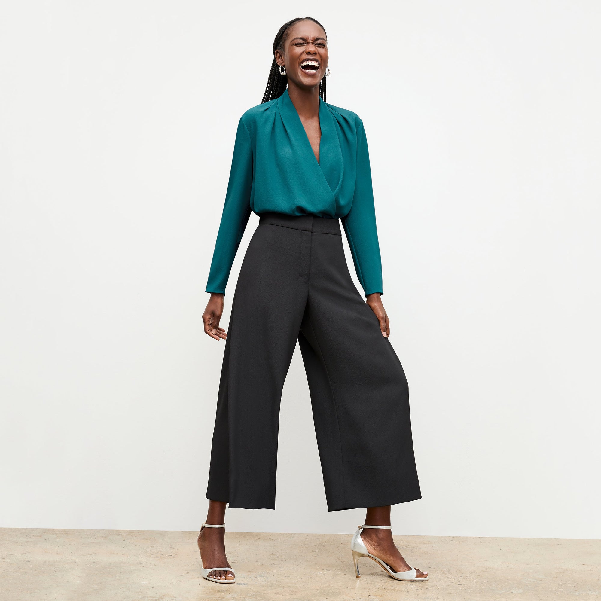 Front image of a woman standing wearing the Zhou culotte in black | Exclude