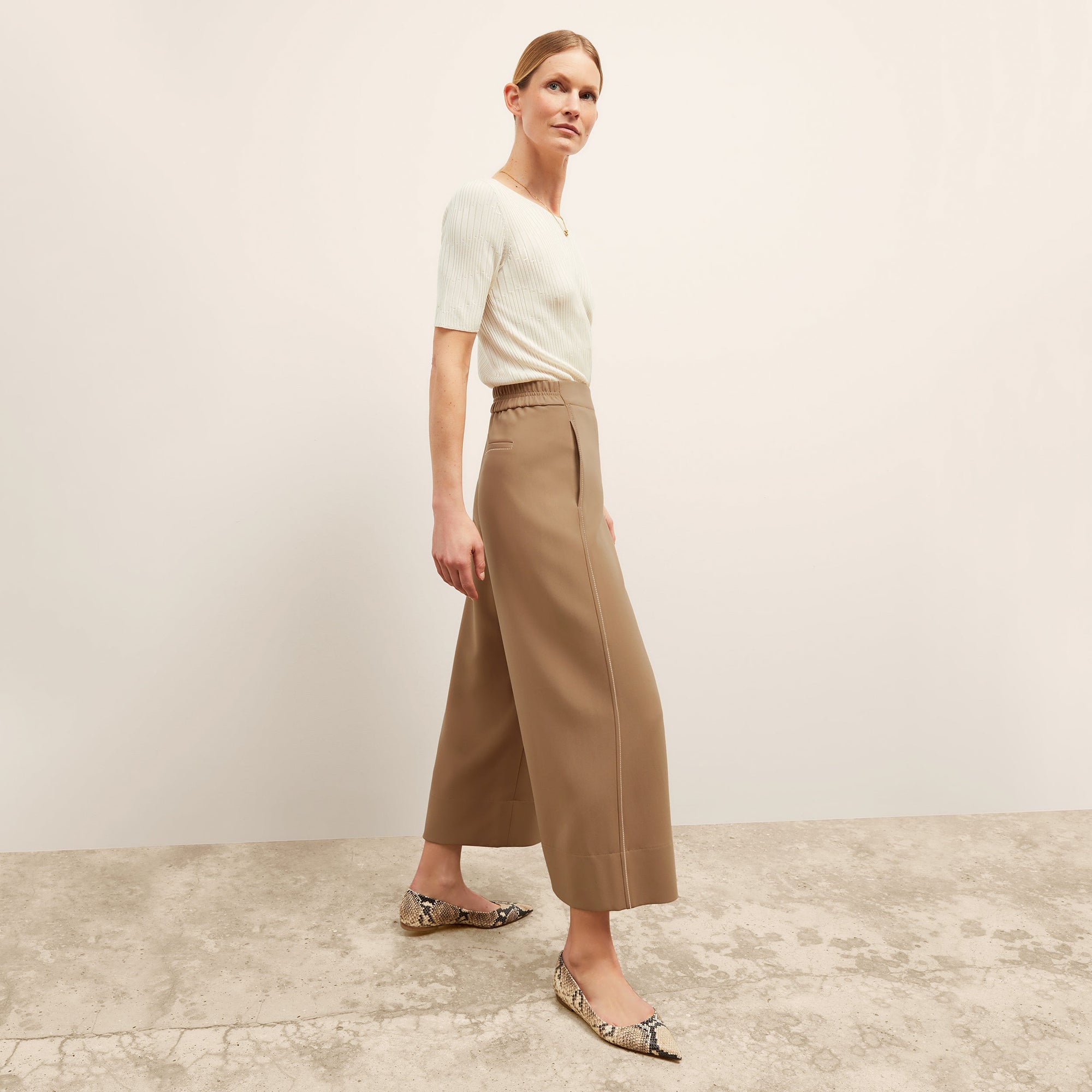 front image of a woman wearing the charlie top in ivory