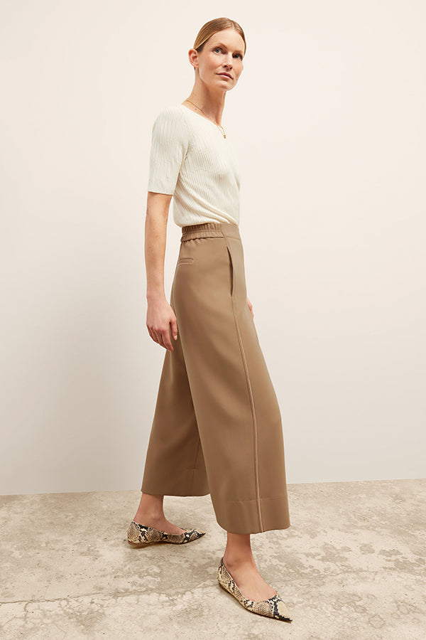front image of a woman wearing the charlie top in ivory | Exclude