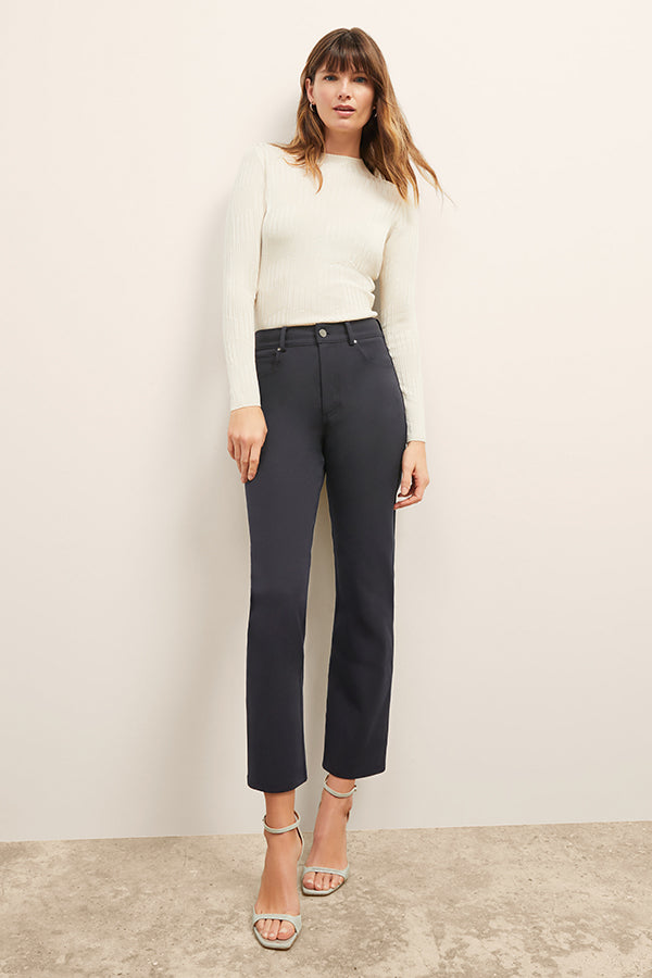 front image of a woman wearing the brodie top in ivory | Exclude