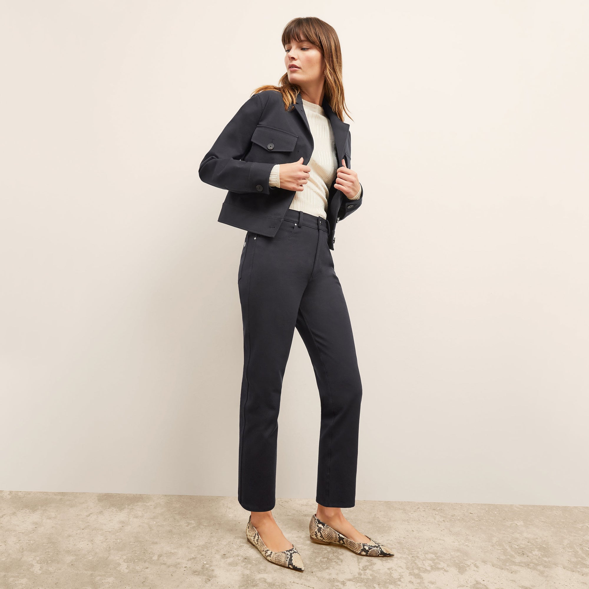 front image of a woman wearing the brodie top in ivory | Exclude