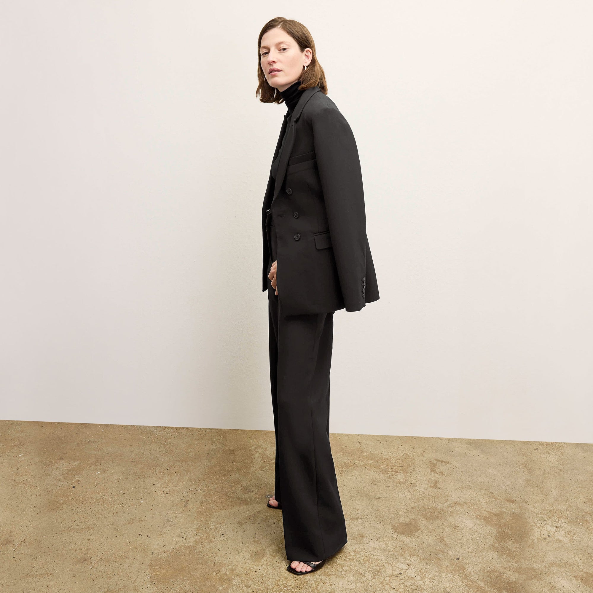 side image of a woman wearing the kati jacket in black