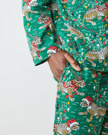 Close-up of the men's mistletoe pajama pants pocket and holiday leopard print