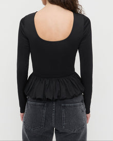 Posie Peplum Top in black jersey material and Winona Denim Barrel Pants in washed black with crystal accents.