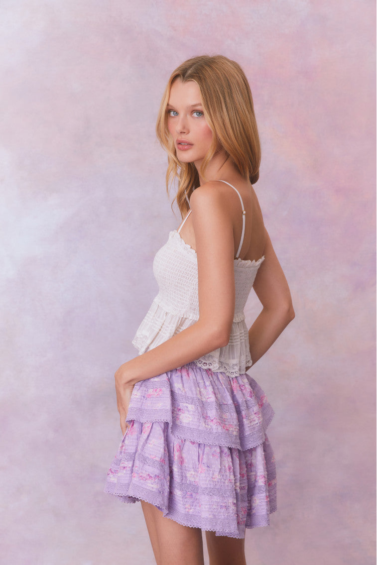 Purple floral ruffle mini skirt with lace on the two tiers. 