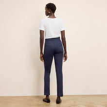 back image of a woman wearing the roma pants in dark navy