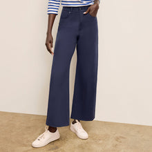 Front image of a woman standing wearing the Milo Jean in ink | Exclude