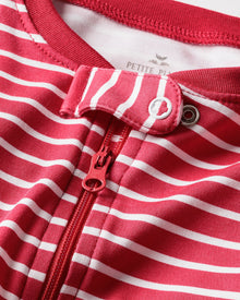 Featuring horizontal red and white stripes, Petite Plumes Babys Pima Romper includes a central zipper and neck button fastener. Made from soft ribbed Pima cotton, it ensures comfort in style.