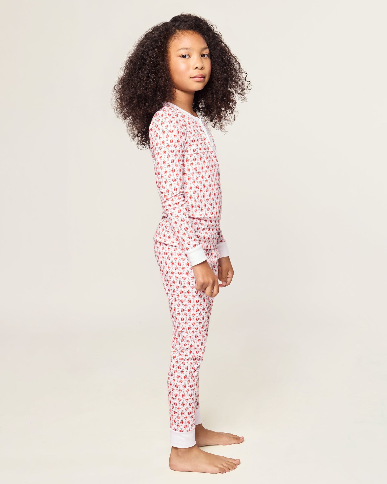 Kid's Pima Snug Fit Pajama Set in Autumn Orchards: two-piece set with long sleeves and pants, featuring a red flower pattern on a white background with solid white cuffs and neckline.