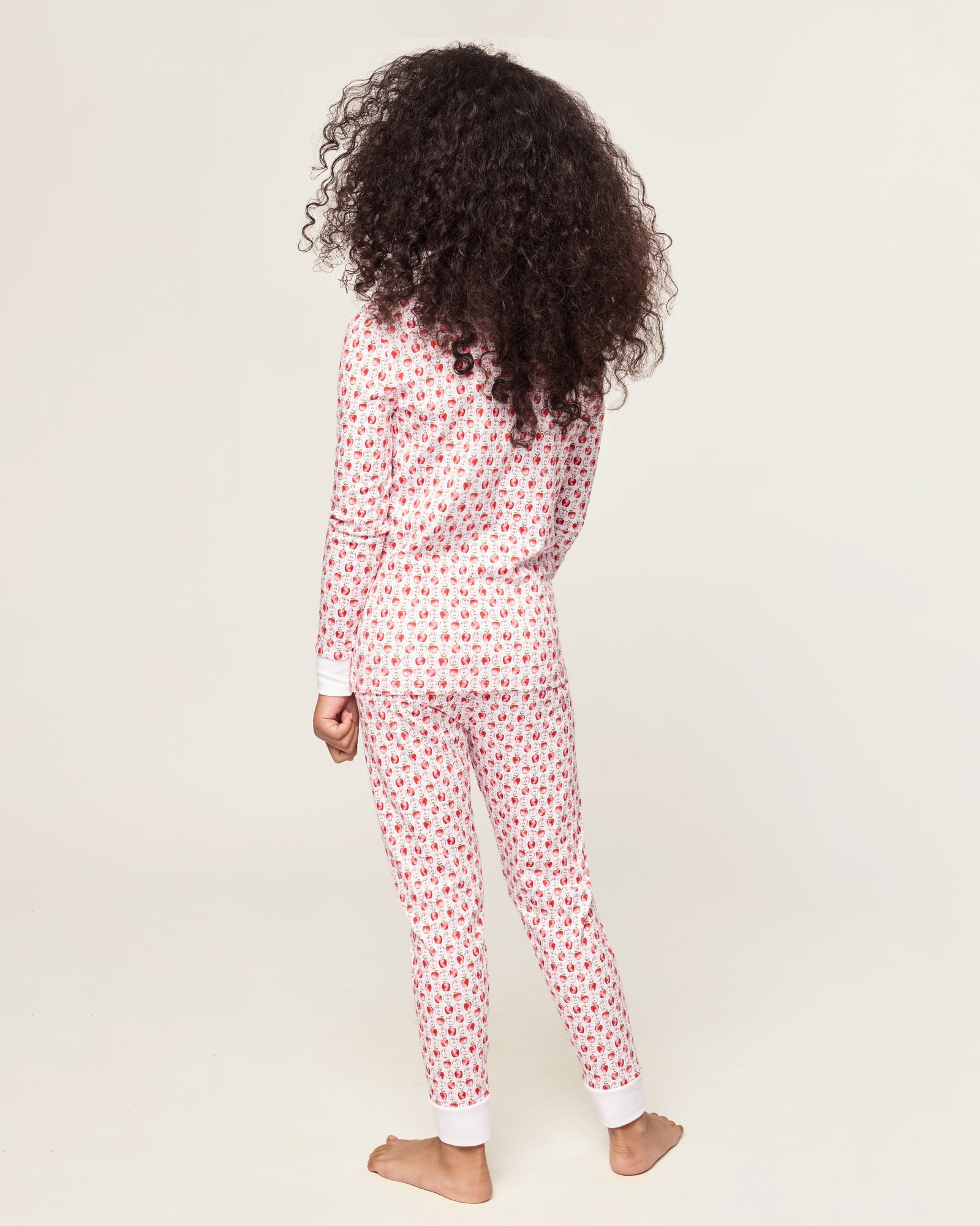Kid's Pima Snug Fit Pajama Set in Autumn Orchards: two-piece set with long sleeves and pants, featuring a red flower pattern on a white background with solid white cuffs and neckline.