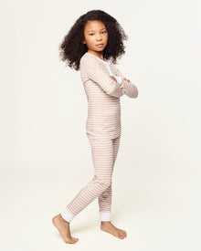 Kid's Pima Snug Fit Pajama Set in Camel Stripe features a beige and white striped long-sleeve top with white cuffs and button placket, plus matching pants with white ankle cuffs.