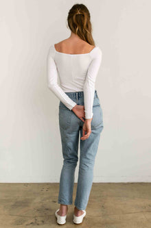 Woman wearing a white long sleeve