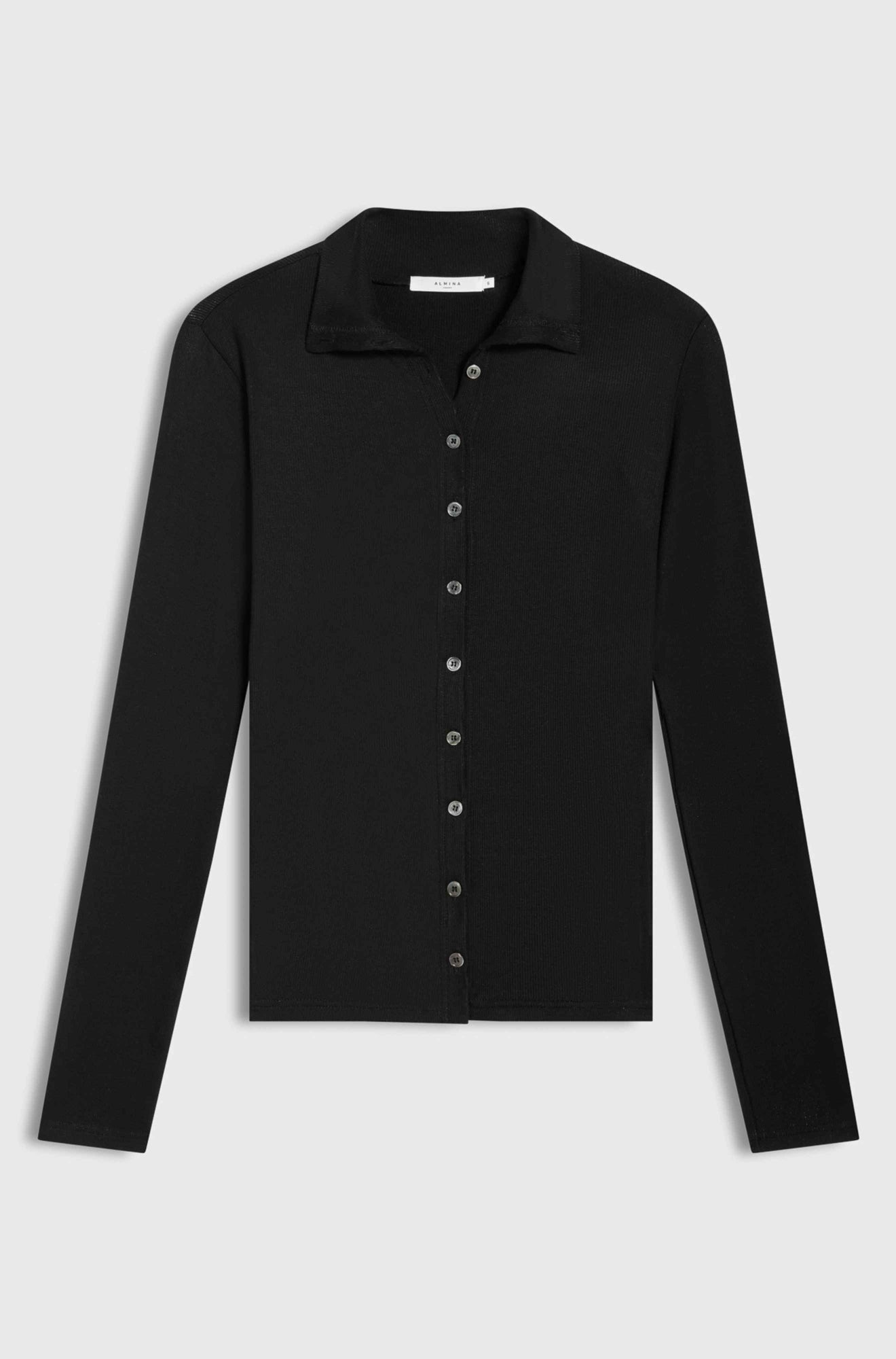 Black button up top on a light grey background