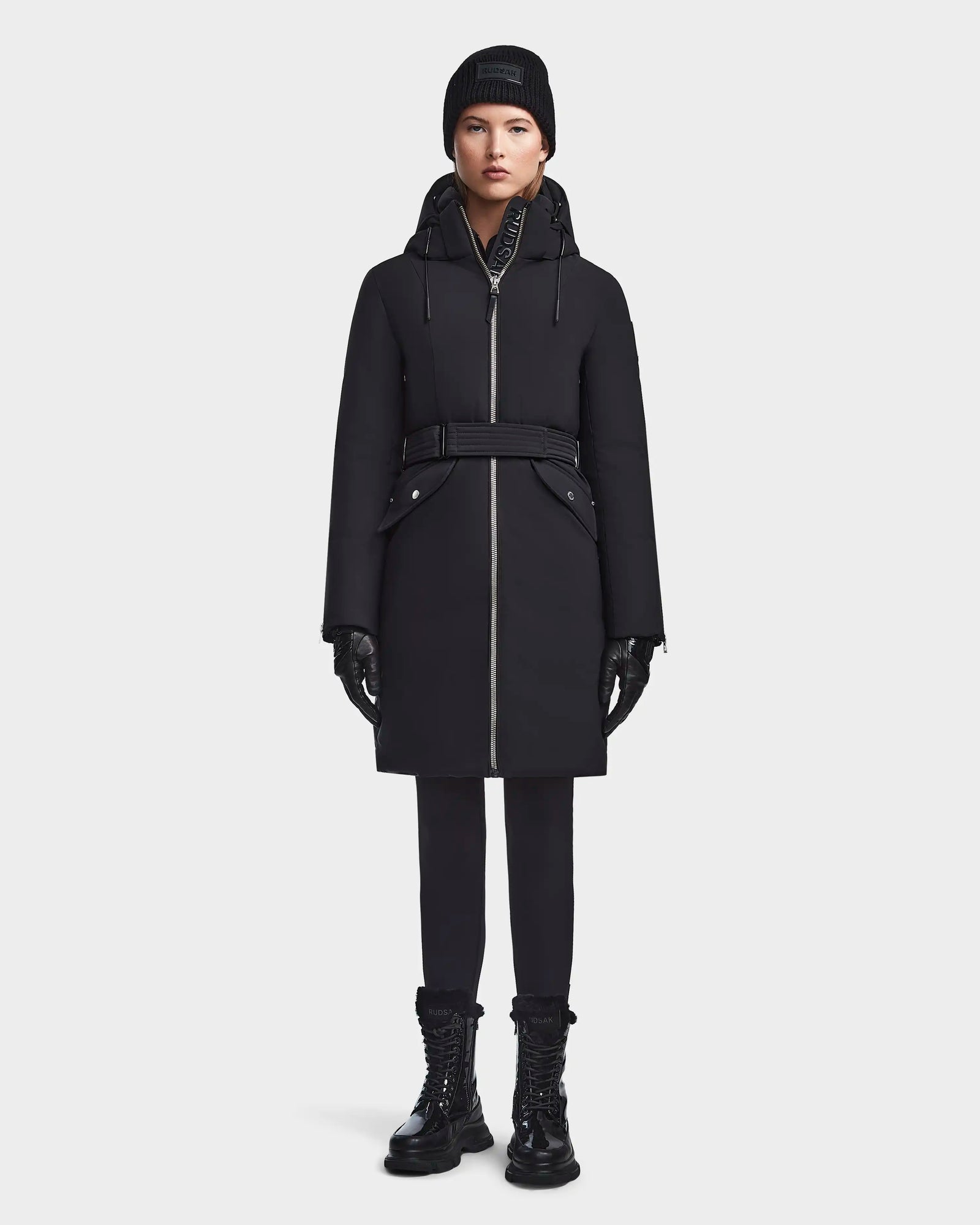 A woman wearing the RUDSAK MILENA - 8122536 BLACK women’s winter coat.
