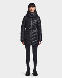 A woman in the Rudsak MALAYA - L123510 Black women’s down puffer jacket with herringbone quilting.