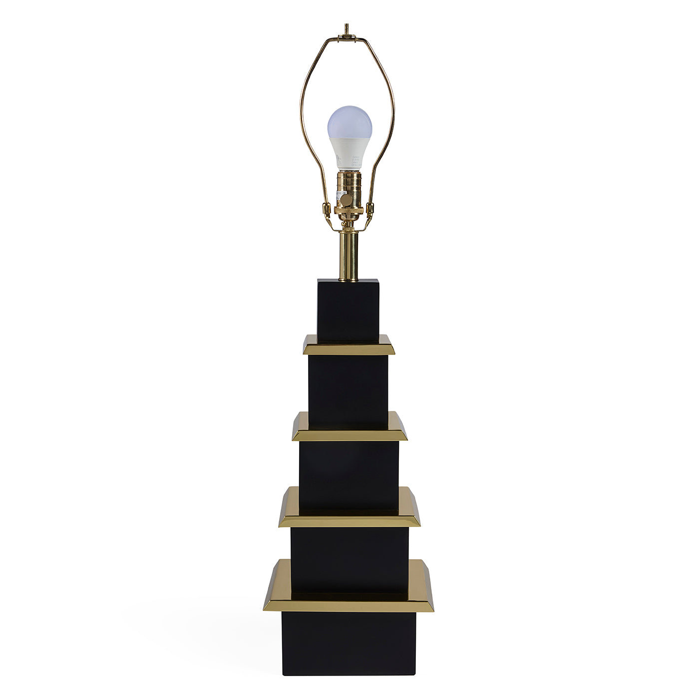 Black and gold lamp with a white light bulb on a white background